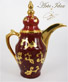 Arte Idea particolare servizio da caffè arabo, decorato a mano con oro zecchino dipinto ed effetti a rilievo su fondo rosso pompeiano. 